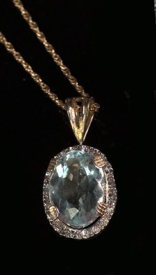 Appraisal: Fourteen-Karat Yellow Gold Aquamarine and Diamond Pendant Necklace featuring a