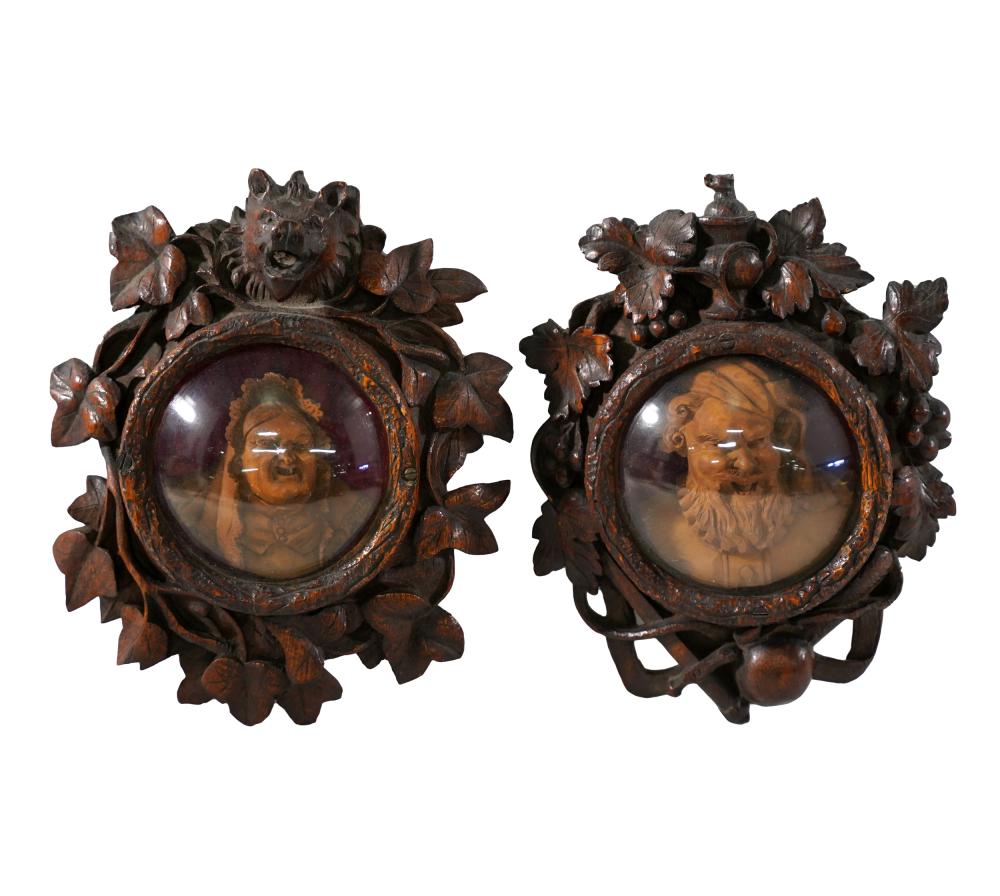 Appraisal: PAIR OF BLACK FOREST FRAMED WOOD CARVINGSeach depicting a head