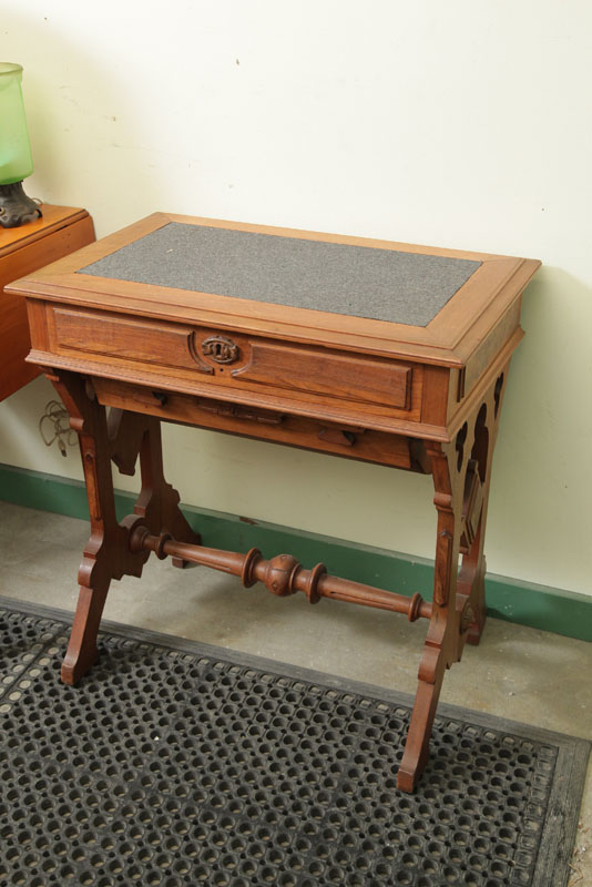 Appraisal: VICTORIAN SEWING STAND Walnut with a felt top bi-directional drawer