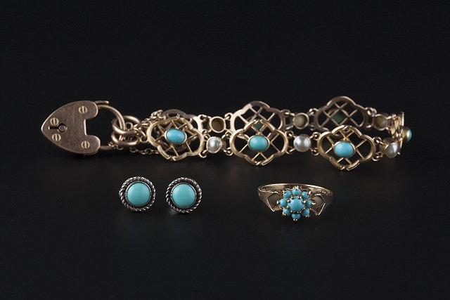 Appraisal: A TURQUOISE SET BRACELET composed of openwork quatrefoil panels with