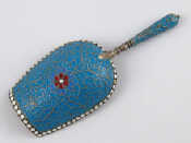 Appraisal: A Russian cloisonne enamelled silver caddy spoon with gilt lined