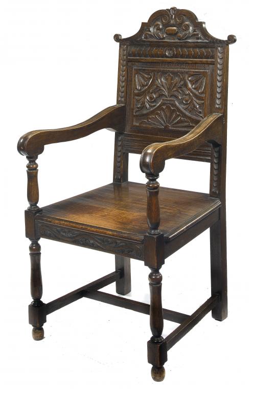 Appraisal: AN OAK ARMCHAIR in th century English style with carved