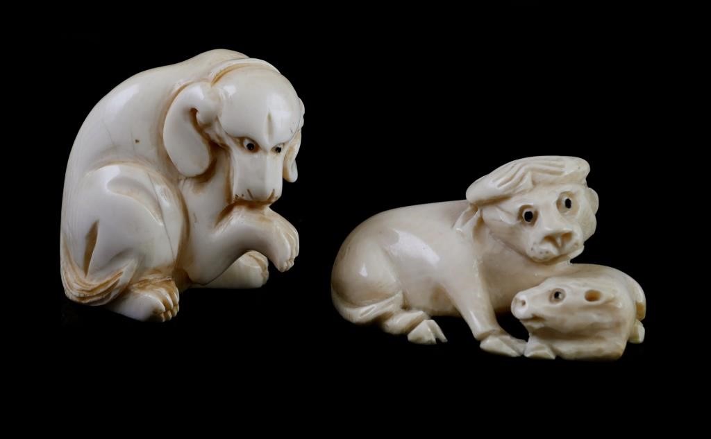 Appraisal: Two carved Japanese ivory netsukes of an ox and calf