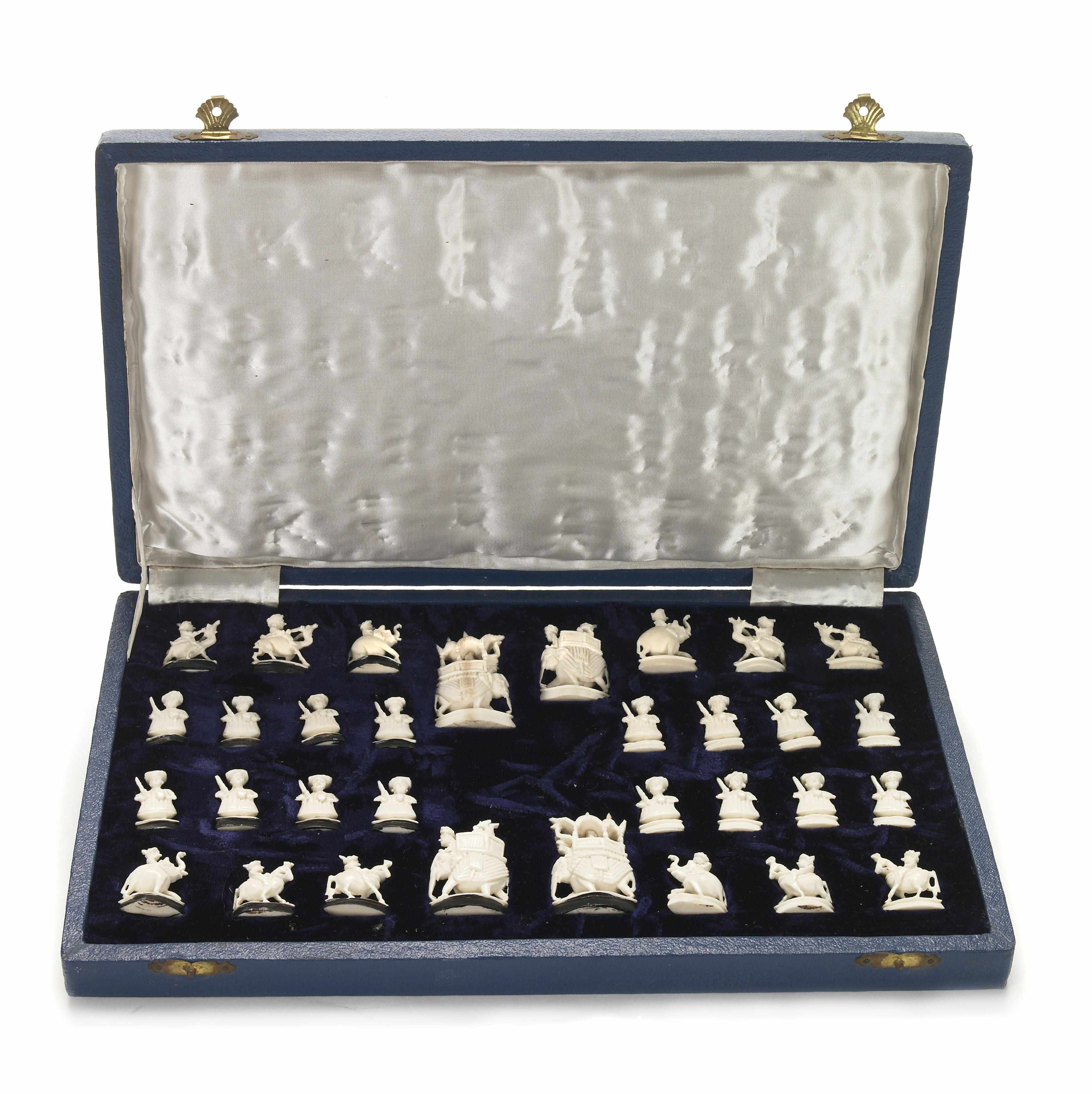 Appraisal: A Chinese carved ivory miniature chess set th centuryheight of