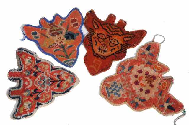 Appraisal: A GROUP OF FOUR TIBETAN ANIMAL MASK DECORATIONS each with