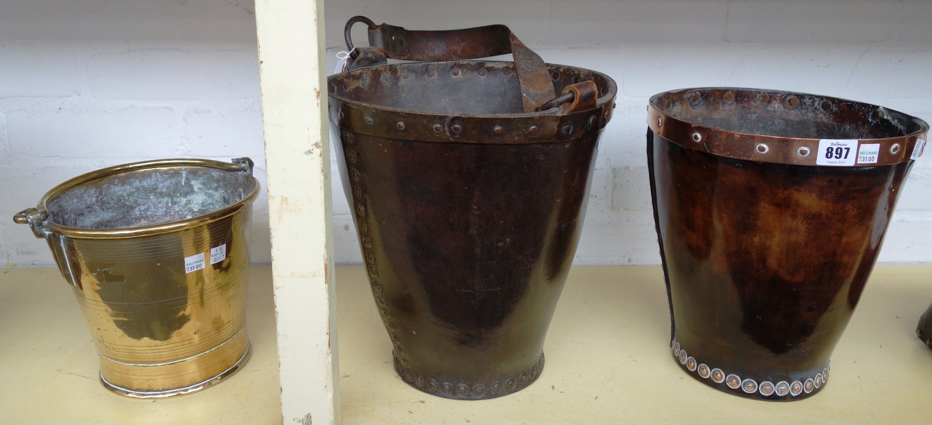 Appraisal: A leather and copper bound shot bucket possibly th century