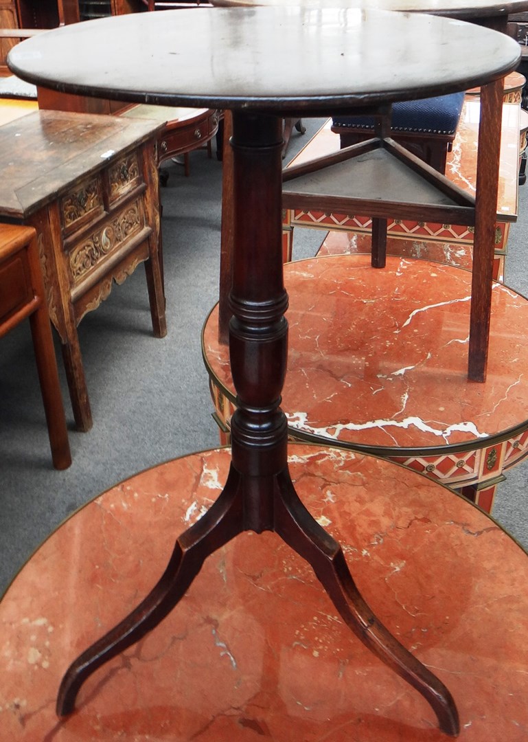 Appraisal: A George III mahogany occasional table the circular snap top