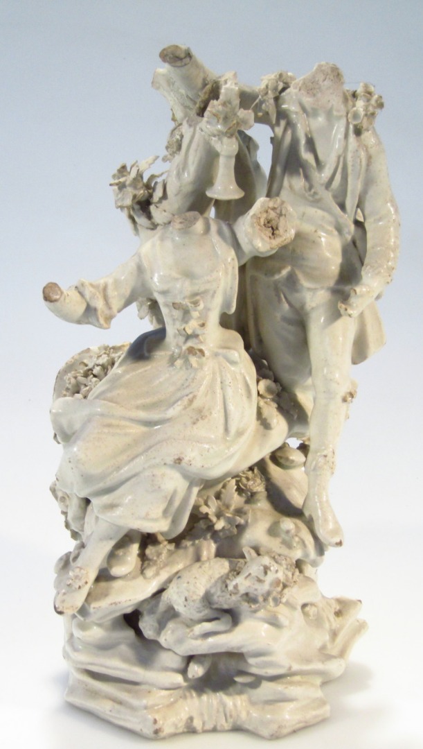 Appraisal: An thC Derby bisque porcelain figure group of a lady