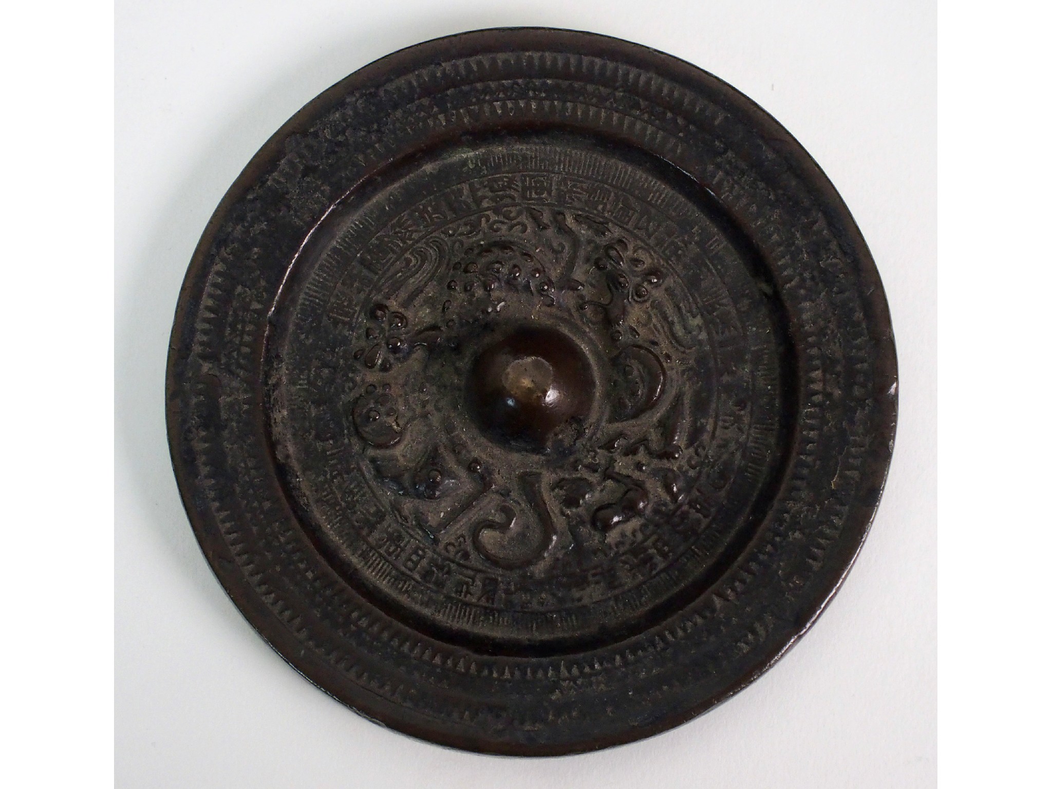 Appraisal: A Chinese bronze circular hand mirrorcast with zodiacal images within