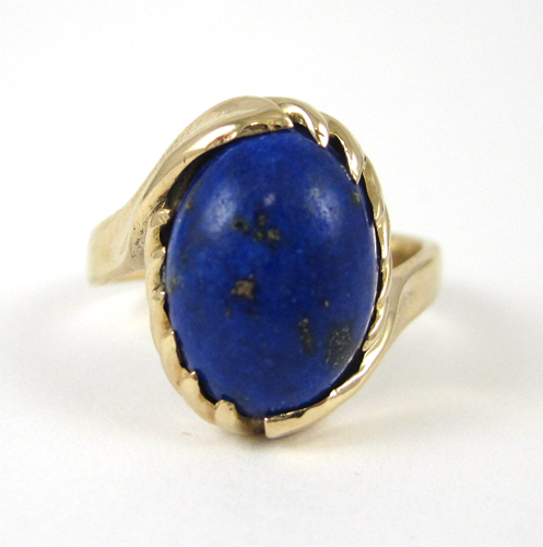 Appraisal: LAPIS LAZULI AND FOURTEEN KARAT GOLD RING set with a