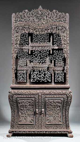 Appraisal: A Chinese Highly Carved Hardwood Display Cabinet late th c