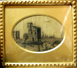 Appraisal: Silk work picture of castle ruins with bridge over a