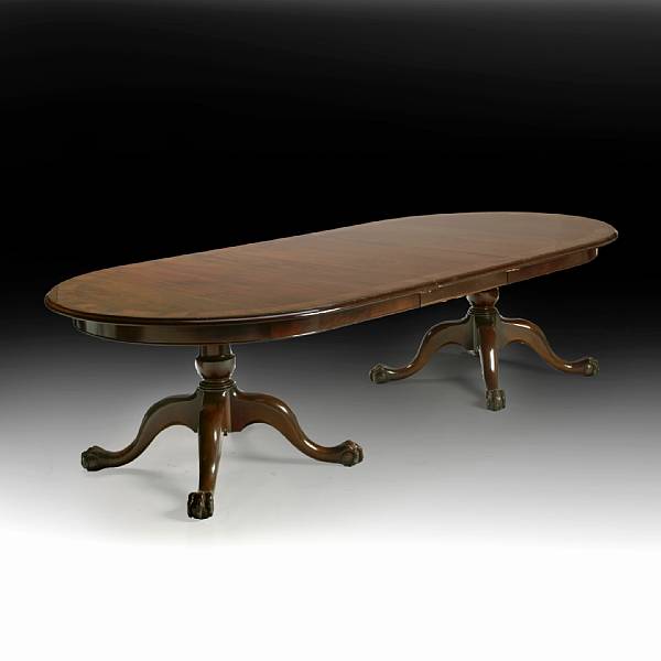 Appraisal: A George III style mahogany dining table The oval top