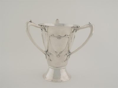 Appraisal: An Edwardian Scottish art nouveau tyg or three handled cup