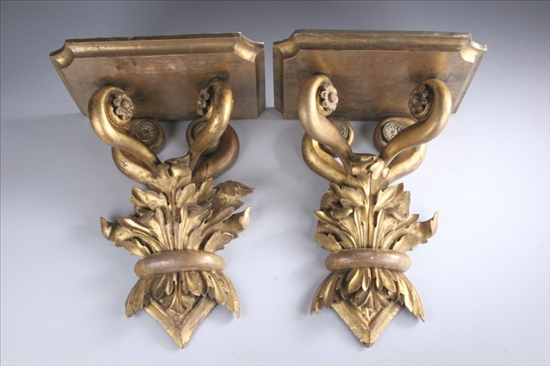 Appraisal: PAIR EMPIRE CARVED AND GILTWOOD WALL BRACKETS Vigorously carved leaf