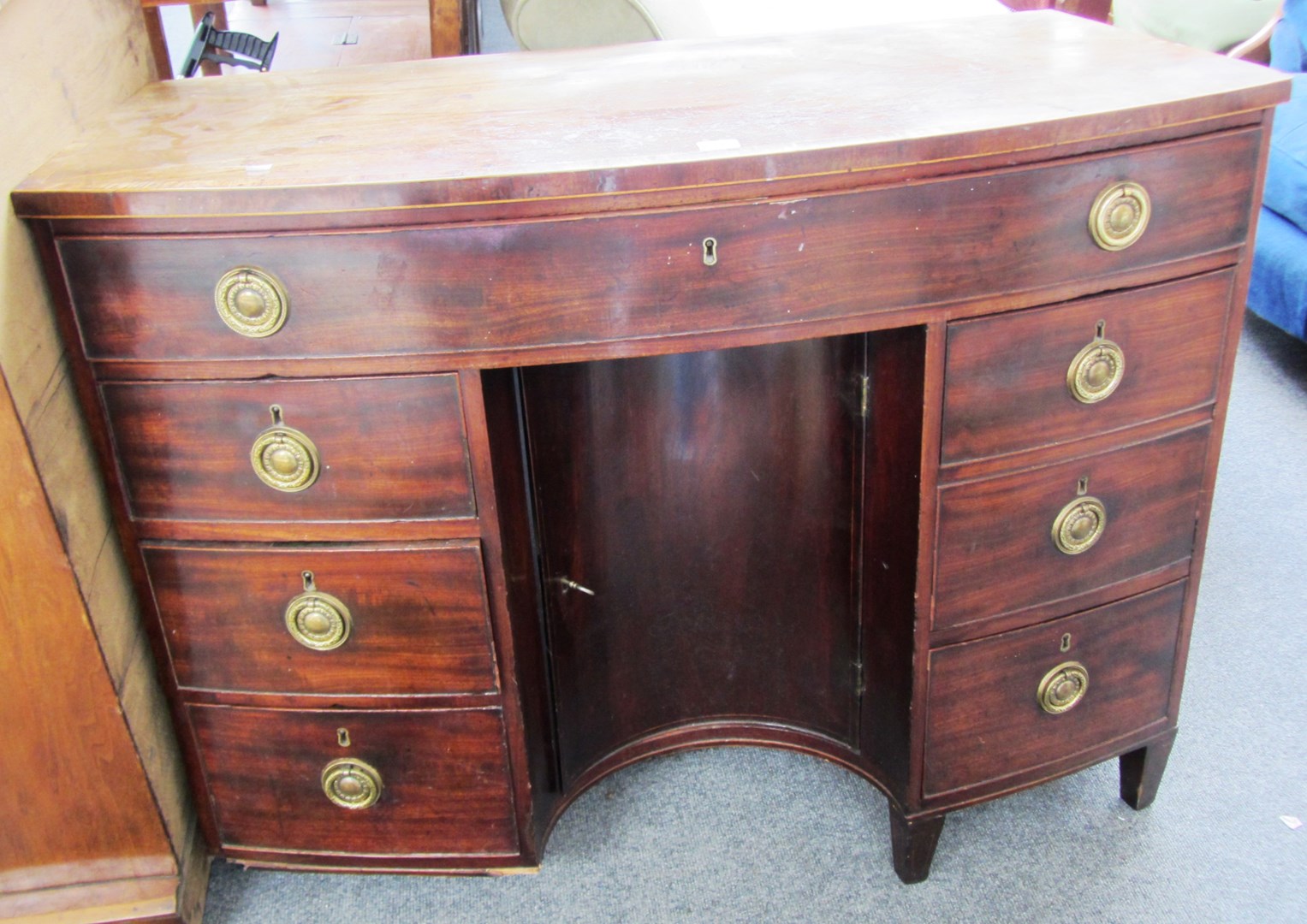 Appraisal: A George III crossbanded mahogany bowfront dressing table with one