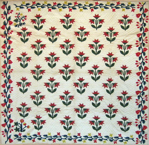 Appraisal: Applique tulip pattern quilt th c with vine border x