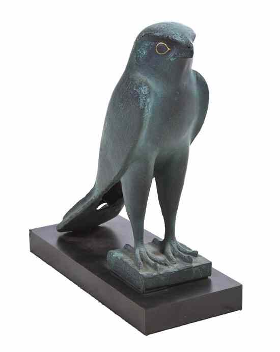 Appraisal: An Egyptian Style Ceramic Bird depicting a standing falcon on