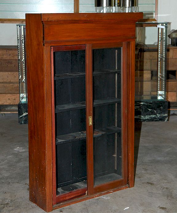 Appraisal: Drug Store Cabinet Ca - A mahogany sliding door cabinet