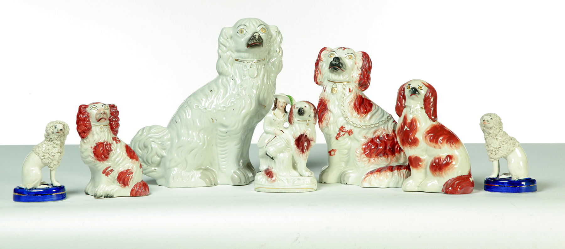 Appraisal: SEVEN STAFFORDSHIRE DOGS England rd quarter- th century Various spaniels