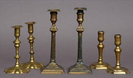 Appraisal: THREE PAIRS OF GEORGIAN BRASS TABLE CANDLESTICKS The largest with