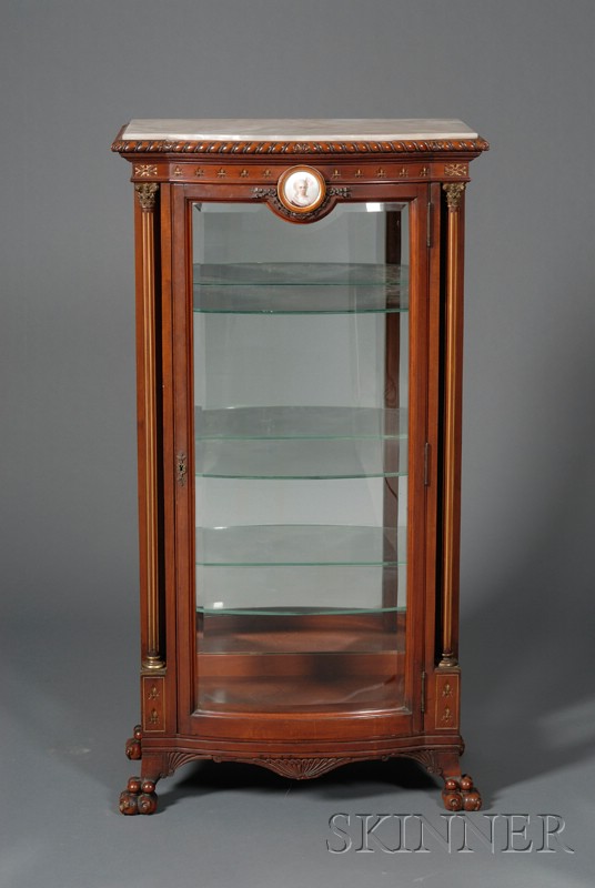 Appraisal: Eastlake Carved Mahogany Parcel-gilt and Porcelain-mounted Onyx Top Display Cabinet