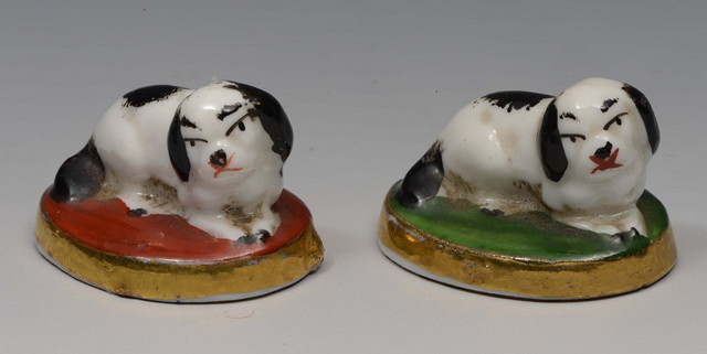 Appraisal: A PAIR OF OVAL MINIATURE CHELSEA STYLE KING CHARLES SPANIELS