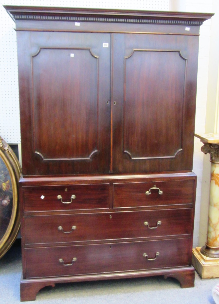 Appraisal: A George III mahogany linen press with pair of panelled