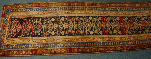 Appraisal: Rectangular blue and cream ground rug decorated with a geometric