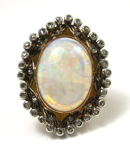 Appraisal: OPAL DIAMONDS AND EIGHTEEN KARAT GOLD RING featuring a large