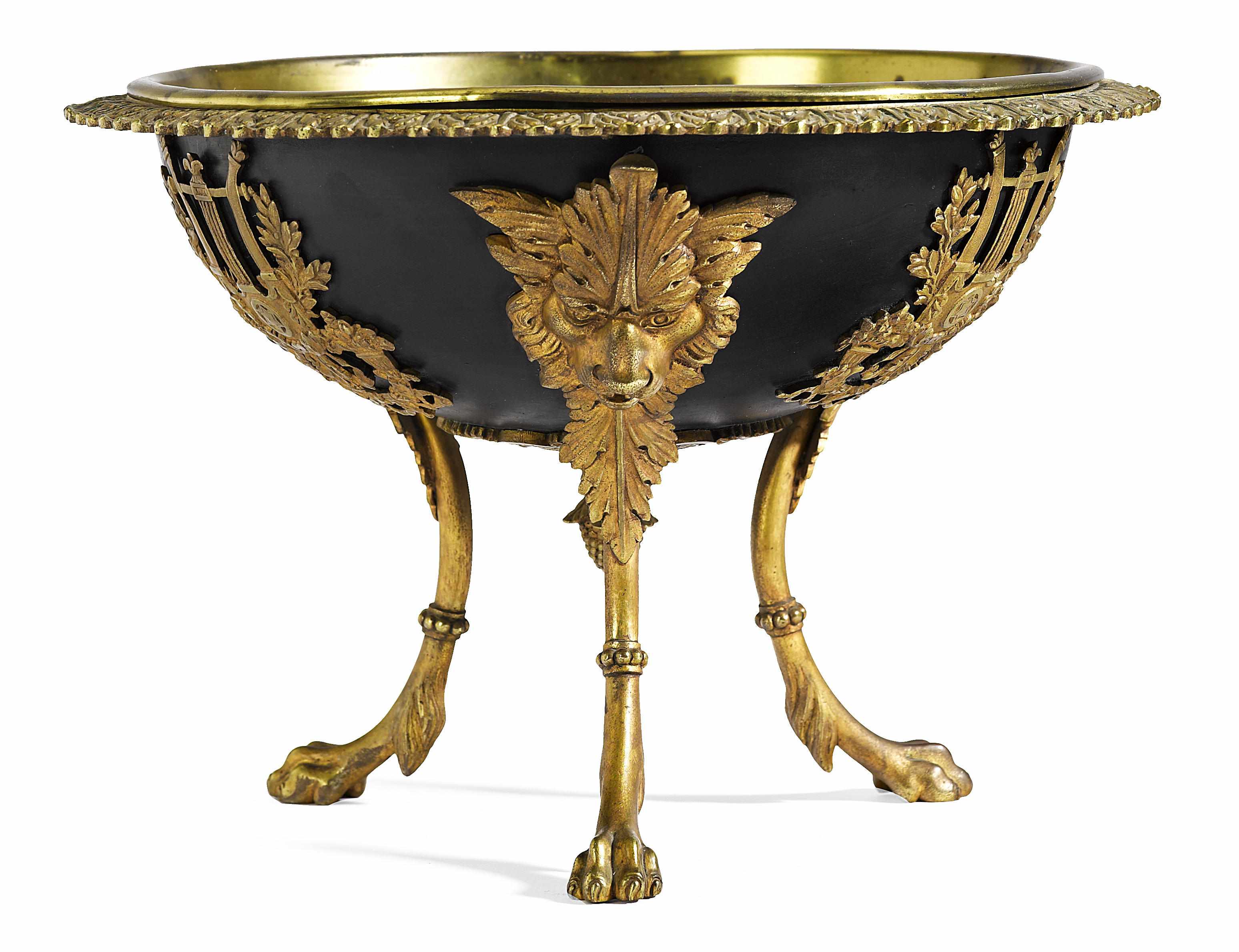 Appraisal: An Empire style gilt bronze mounted patinated metal center bowl