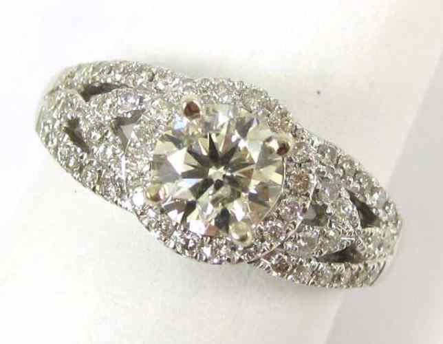 Appraisal: DIAMOND AND FOURTEEN KARAT WHITE GOLD RING with pave' set