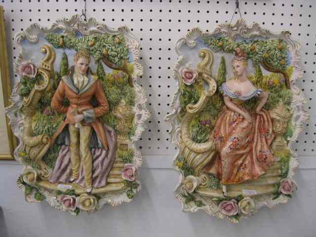 Appraisal: Pair of Italian Figural Pottery Plaques man worman garden scenes