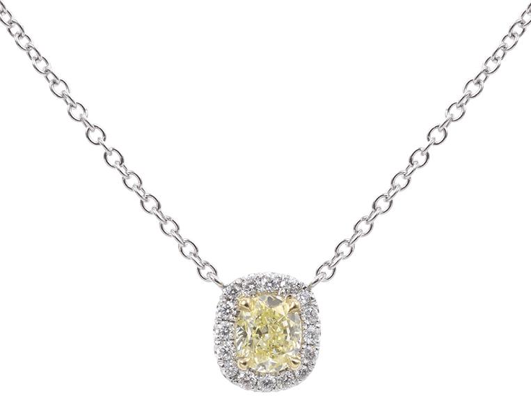 Appraisal: A FANCY YELLOW DIAMOND PENDANT Centrally set with an oval