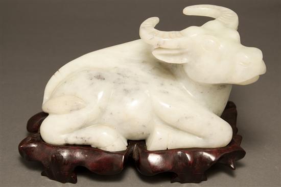 Appraisal: Chinese carved hardstone water buffalo with fitted wood stand buffalo