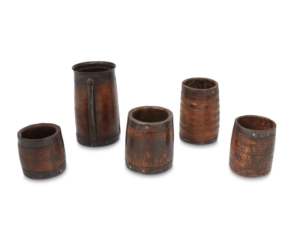 Appraisal: A collection of treen wood and metal barrels th century