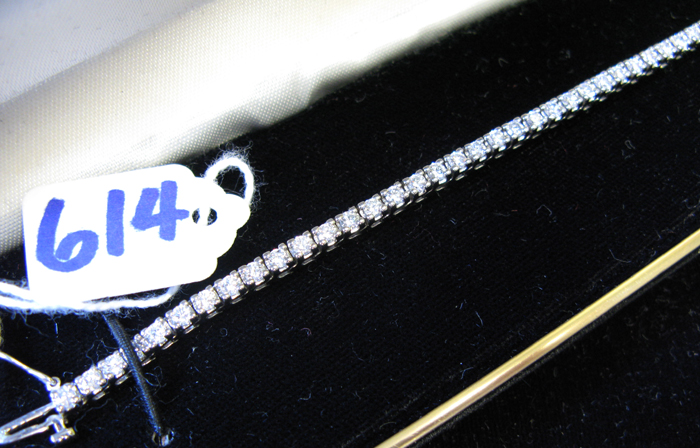 Appraisal: DIAMOND AND FOURTEEN KARAT WHITE GOLD TENNIS BRACELET - inches