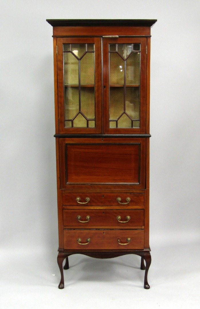 Appraisal: An Edwardian mahogany and boxwood line inlaid secretaire cabinet two