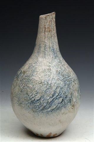 Appraisal: A BETTY BLANDINO TALL EARTHENWARE VASE in blue white and