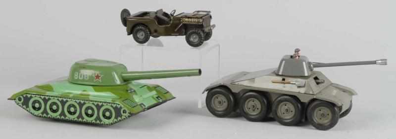 Appraisal: Lot of Tin Military Vehicle Toys Description Includes French Veve