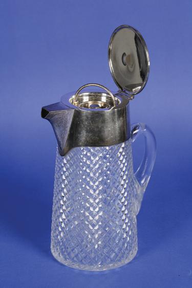 Appraisal: A CUT-GLASS LEMONADE JUG with electroplated mounts of tapering circular