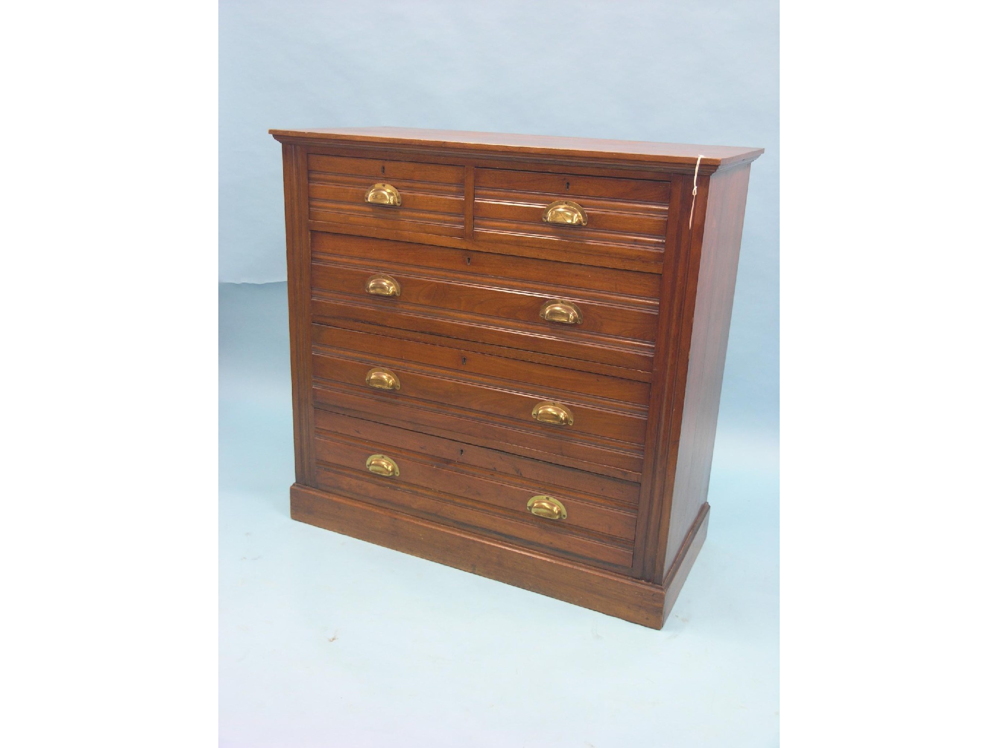 Appraisal: A late Victorian walnut chest two short and three long