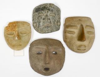 Appraisal: GROUP OF FOUR STONE MASKS Various origins dates and materials