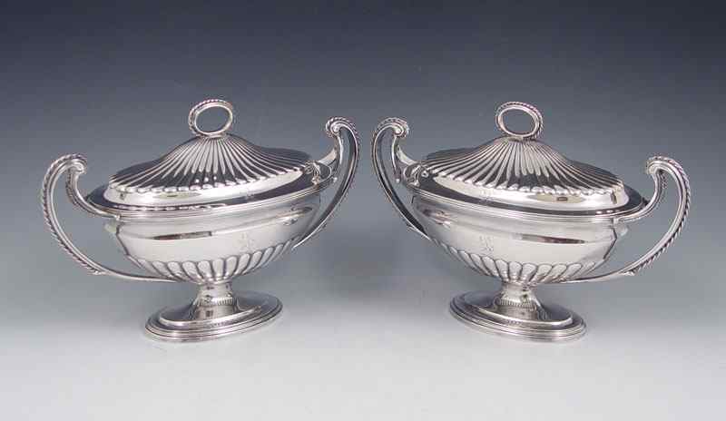 Appraisal: PAIR ENGLISH SILVER COVERED HANDLED STERLING SERVING DISHES Hallmarked with