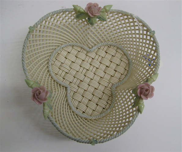 Appraisal: IRISH BELLEEK TRIFOLD FORM TWIG BASKET -strand with painted pink