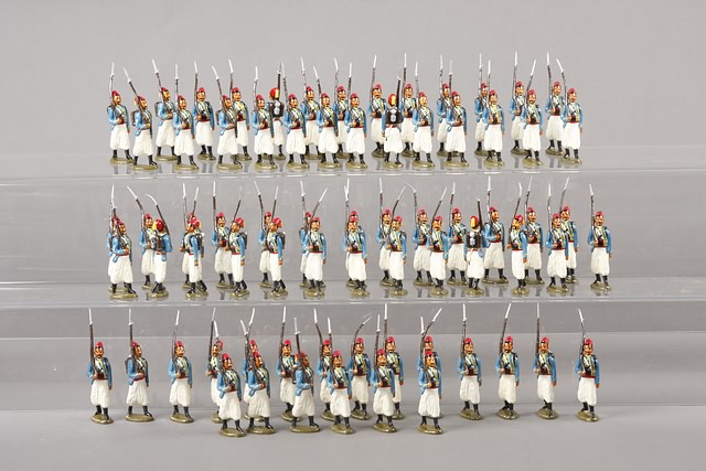 Appraisal: Lot of metal figures representing French Turcos marching Gloss paint