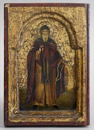 Appraisal: RUSSIAN PAINTED WOOD ICON OF A SAINT Depicted standing in