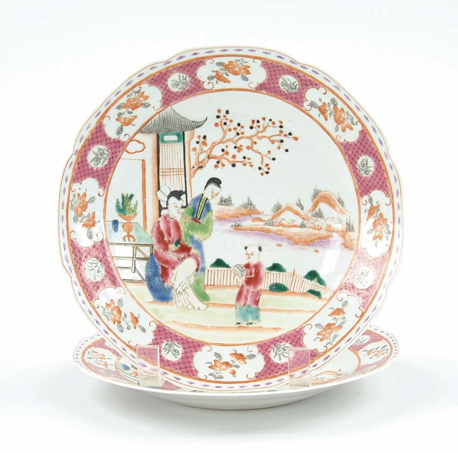 Appraisal: PAIR OF ORIENTAL EXPORT PLATES Center scene has boy holding