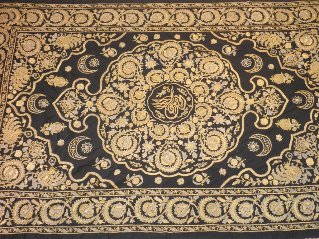 Appraisal: A middle eastern bed cover decorated with a design of