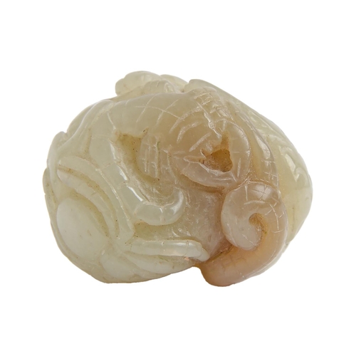 Appraisal: A Chinese jade pebble carving with a dog of Fo